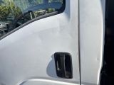 a close up of a white truck door handle