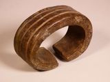 an image of a wooden bracelet with holes in the middle