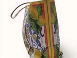 a purse that has a lemon print on it