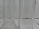 two vases sitting on the floor next to each other