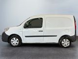 the white van is parked in a room with a gray floor