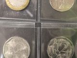 six different types of coins are in a plastic case