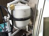a white tank that is sitting in a room
