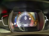 a car dashboard with a speedometer and a clock on it