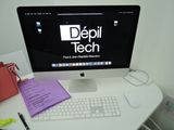 a desktop computer sitting on a desk with a keyboard and mouse