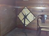 a small table and chair in the corner of a room