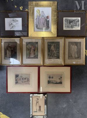 many framed pictures on the wall of a room