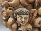 a statue of a woman with a bunch of hair on it ' s head