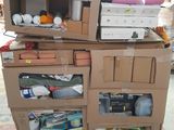 boxes stacked on top of each other on a pallet in a garage