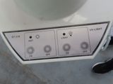 a close up of a button on the side of a blender