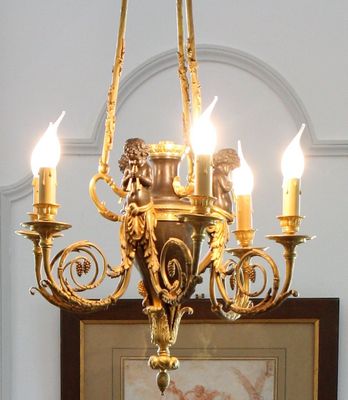 a picture of a chandelier with candles on it