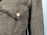 a close up of a jacket with a button on it