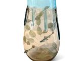 a glass vase with a design on it on a white background
