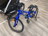 a blue bike with a trailer attached to it