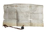 un vieux bout de papier sur lequel il y a des mots, posé sur un autre bout de papier