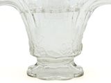 a glass vase that is sitting on a white surface