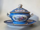 a blue and white bowl and saucer on a saucer
