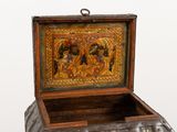 a wooden box with a painting on the inside of it