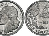 a close up of a coin with a woman ' s face on it
