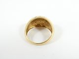 an 18k gold ring set with a diamond set in the center