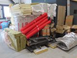 a large pile of boxes and other items in a warehouse