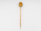 a gold plated stick with a lion head on it