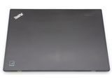the back of a laptop with a black cover on a white surface
