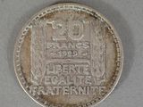an old coin that is sitting on a table