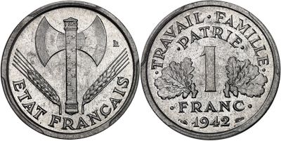 a close up of a coin with a knife on it
