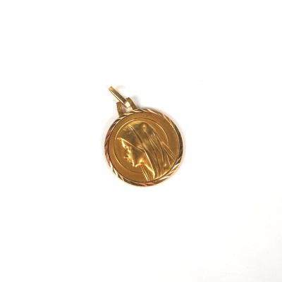l'image d'une pièce d'or sur laquelle figure le visage d'une femme