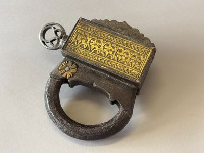 a ring that has a gold and silver design on it
