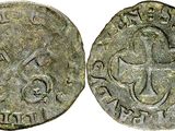 a silver coin with a cross on the front and a cross on the back