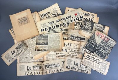 several newspapers are piled on top of each other on a blue surface