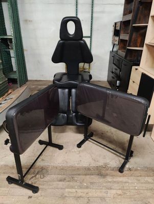 a chair that is sitting in the middle of a room