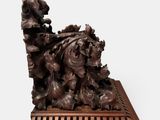 an image of a wooden sculpture of a dog and a cat