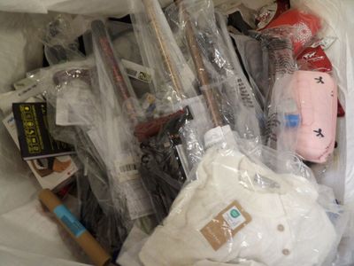 a plastic bag full of items that are in the trash