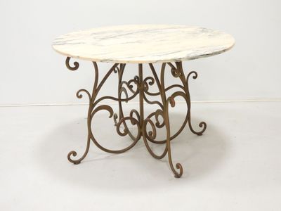 wrought iron table with a marble top on a white background