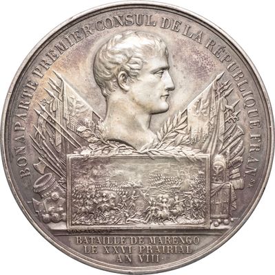 une image représentant une médaille d'argent ornée du buste d'un homme