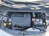 the engine of a car with its hood open and the hood down