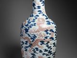 an image of a vase with a dragon design on it