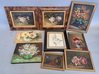 six framed pictures of flowers in vases on a table