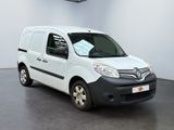 the white van is parked in a large room with a black floor