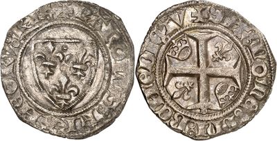 a silver coin with a cross on the front and a shield on the back