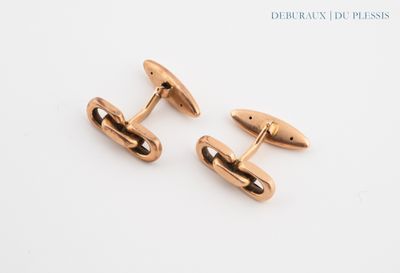 two pairs of rose gold cufflinks on a white background