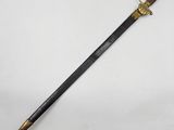an old sword with a wooden handle and a brass handle