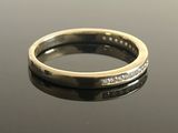 an image of a wedding ring with diamonds on it