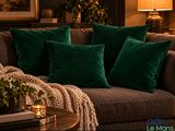 pillows on a couch in a living room next to a coffee table