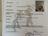 someone is holding up a certificate with a picture of a man on a horse