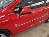 a red car that is parked in a garage