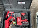 a tool box with tools in it sitting on the ground
